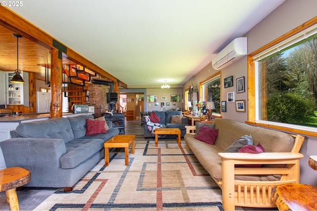 living area with a notable chandelier, a wood stove, and a wall mounted AC