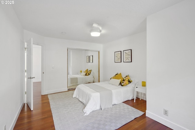 11010 SE Green Valley Rd, Sandy, OR 97055 - bedroom with a closet, baseboards, and wood finished floors