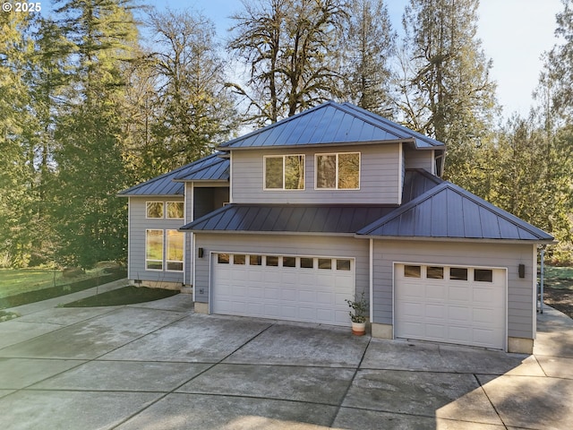 11010 SE Green Valley Rd, Sandy, OR 97055 - view of front of home with an attached garage, metal roof, and concrete driveway