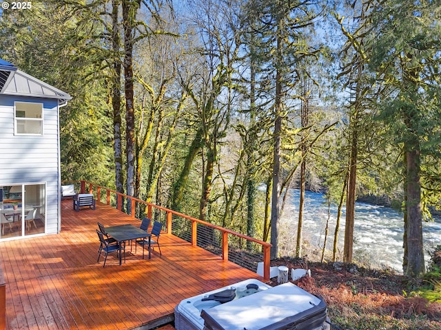 wooden terrace with a wooded view