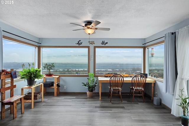 sunroom / solarium with ceiling fan