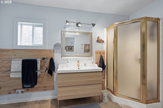 bathroom with vanity and a shower with shower door