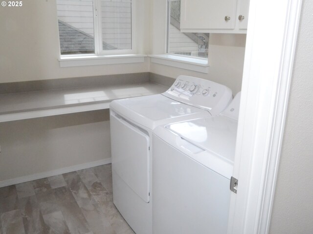 laundry area with cabinet space and washing machine and clothes dryer