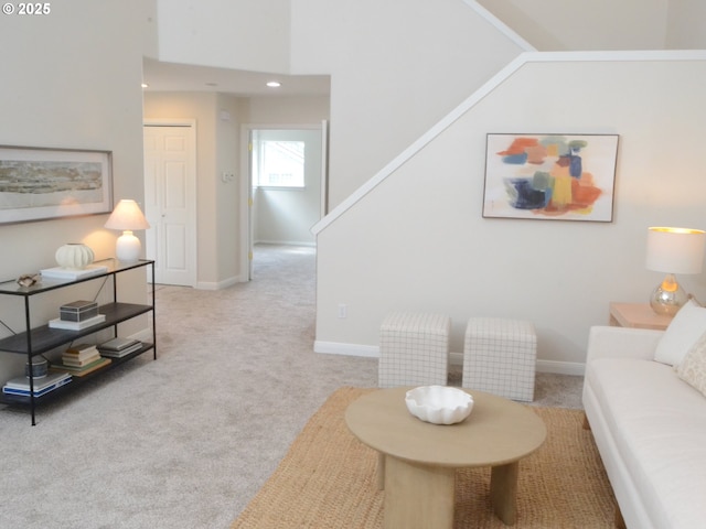 carpeted living area featuring recessed lighting, stairway, and baseboards
