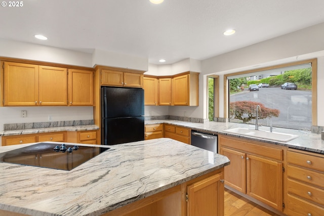 2305 Chickadee Ct, West Linn, OR 97068 - kitchen with black appliances, a sink, recessed lighting, light wood-style flooring, and light stone countertops