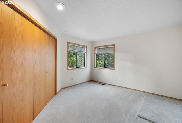 2305 Chickadee Ct, West Linn, OR 97068 - unfurnished bedroom with light colored carpet, a closet, and baseboards