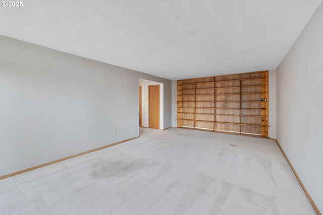 2305 Chickadee Ct, West Linn, OR 97068 - spare room with built in shelves, baseboards, and light carpet