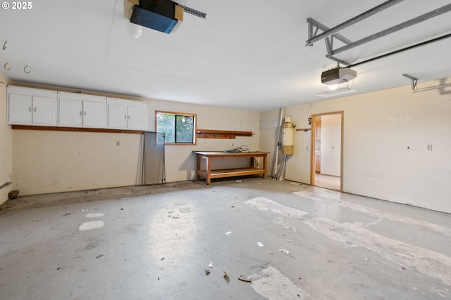 2305 Chickadee Ct, West Linn, OR 97068 - garage featuring a garage door opener and a central vacuum unit