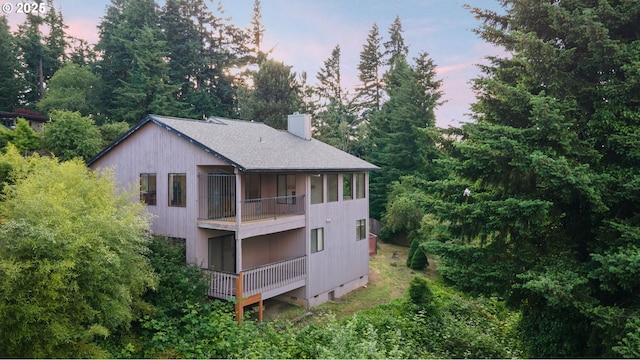 2305 Chickadee Ct, West Linn, OR 97068 - back of property at dusk with a chimney and a balcony