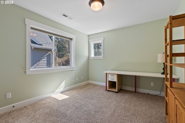 unfurnished bedroom with visible vents, carpet floors, and baseboards