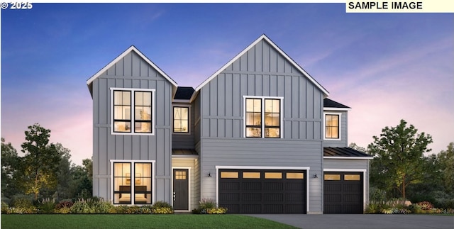 modern farmhouse with an attached garage, a standing seam roof, board and batten siding, and concrete driveway