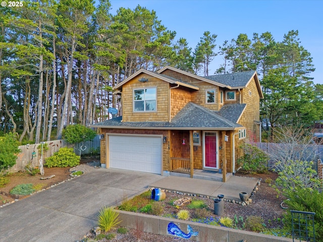 view of front of home featuring driveway, fence, a garage, and roof with shingles