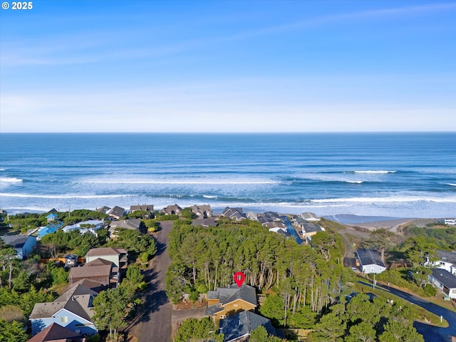 drone / aerial view with a residential view and a water view
