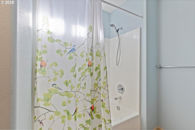 full bathroom with shower / bath combo