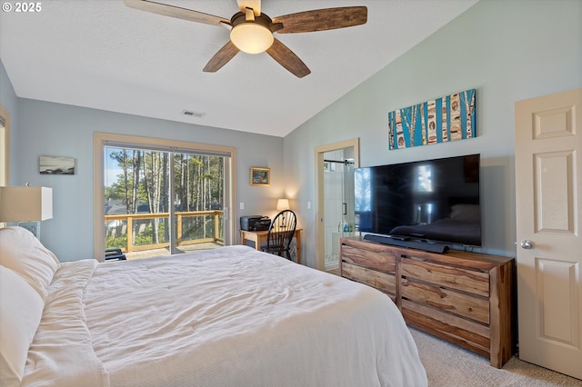 bedroom featuring carpet, visible vents, vaulted ceiling, and ceiling fan