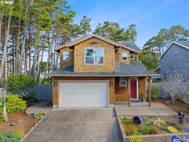 view of front of property with a shingled roof, concrete driveway, a garage, and fence