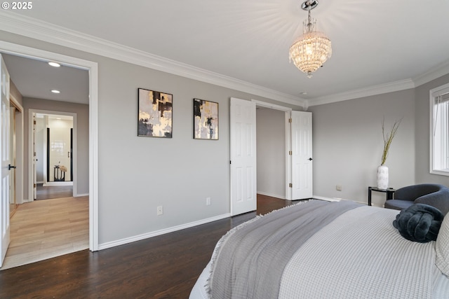 bedroom with wood finished floors, baseboards, recessed lighting, crown molding, and a chandelier