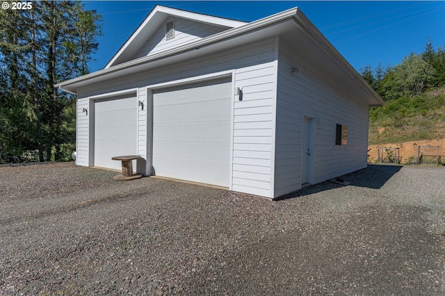 garage featuring driveway