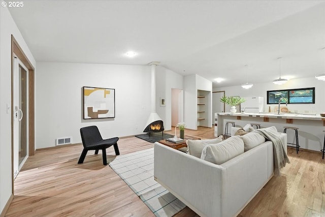 80487 Sha Ne Mah Rd, Seaside, OR 97138 - living area with light wood finished floors and lofted ceiling