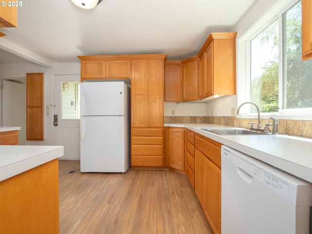 3511 SW Coronado St, Portland, OR 97219 - kitchen featuring white appliances, light countertops, and light wood-style flooring