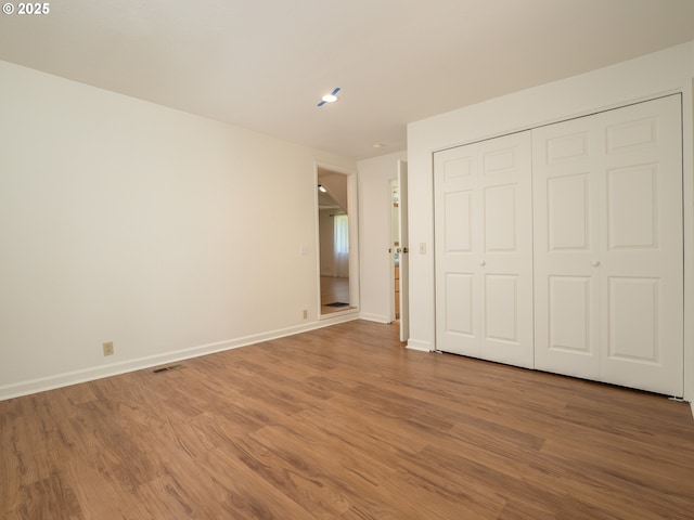 3511 SW Coronado St, Portland, OR 97219 - unfurnished bedroom with wood finished floors and a closet