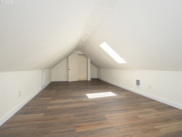 3511 SW Coronado St, Portland, OR 97219 - additional living space featuring a skylight, vaulted ceiling, and wood finished floors