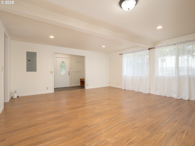 3511 SW Coronado St, Portland, OR 97219 - unfurnished living room featuring electric panel, light wood-style floors, and recessed lighting