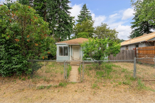 206 NE Laurel Ave, Myrtle Creek, OR 97457 - view of outbuilding with a gate and a fenced front yard