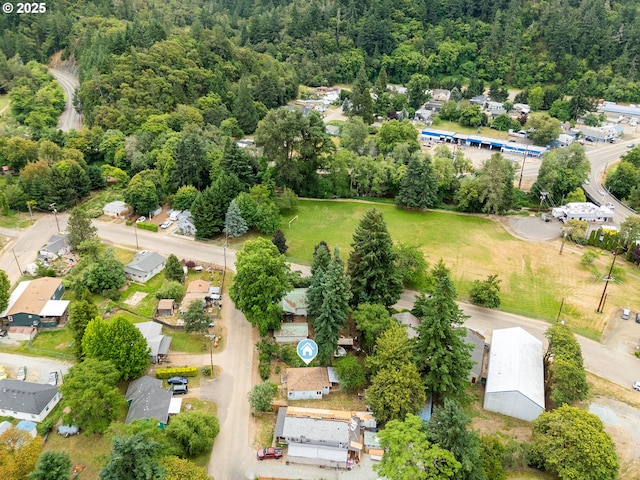 206 NE Laurel Ave, Myrtle Creek, OR 97457 - aerial view of residential area featuring a heavily wooded area