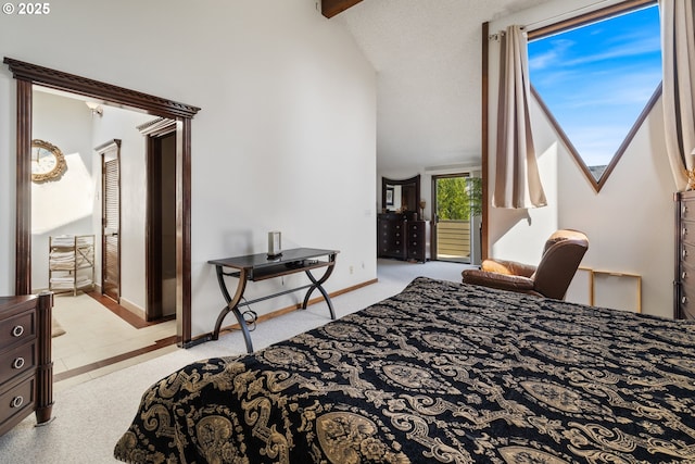 bedroom with vaulted ceiling and baseboards