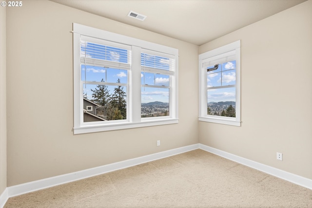 empty room featuring carpet flooring