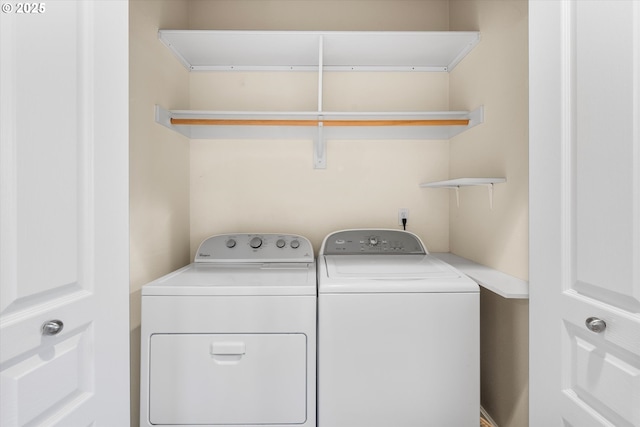 washroom with separate washer and dryer