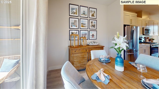 dining space with light wood-type flooring