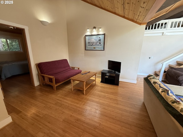 3140 S Tenmile, Lakeside, OR 97449 - living room with light wood finished floors, baseboards, lofted ceiling, stairs, and wooden ceiling