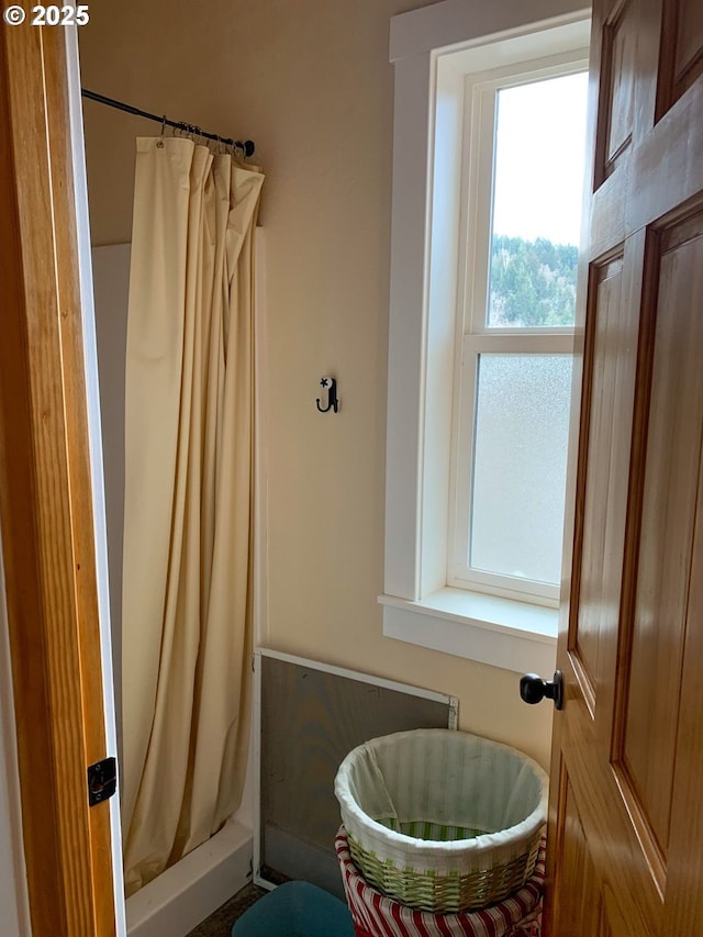 bathroom with curtained shower