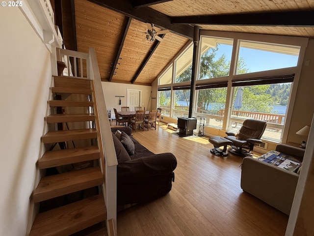 3140 S Tenmile, Lakeside, OR 97449 - living room featuring beamed ceiling, plenty of natural light, stairs, and wooden ceiling