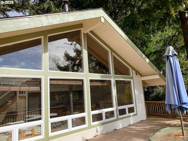 view of side of home with a sunroom