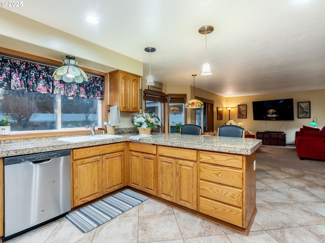 kitchen featuring kitchen peninsula, stainless steel dishwasher, hanging light fixtures, light tile patterned floors, and sink