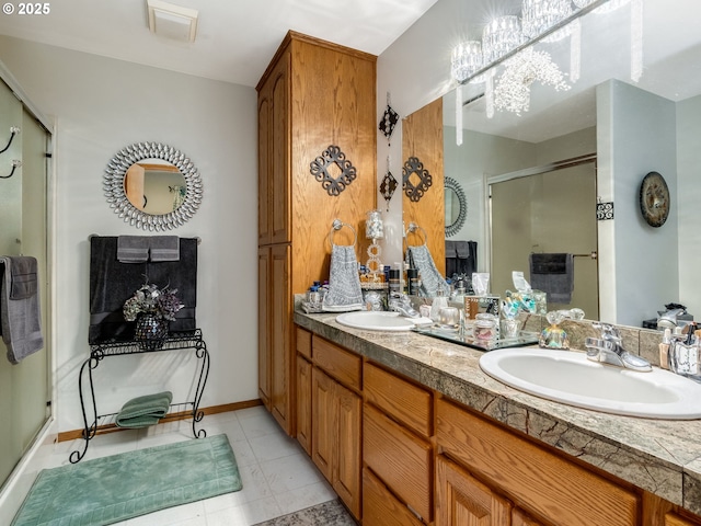 bathroom featuring an enclosed shower and vanity