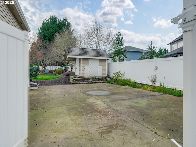 view of patio featuring a shed