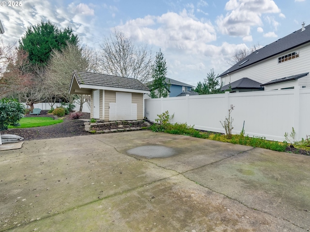 view of patio featuring a shed