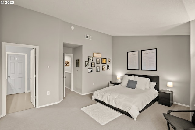 carpeted bedroom featuring vaulted ceiling