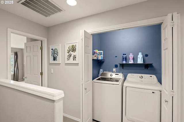 laundry area featuring separate washer and dryer