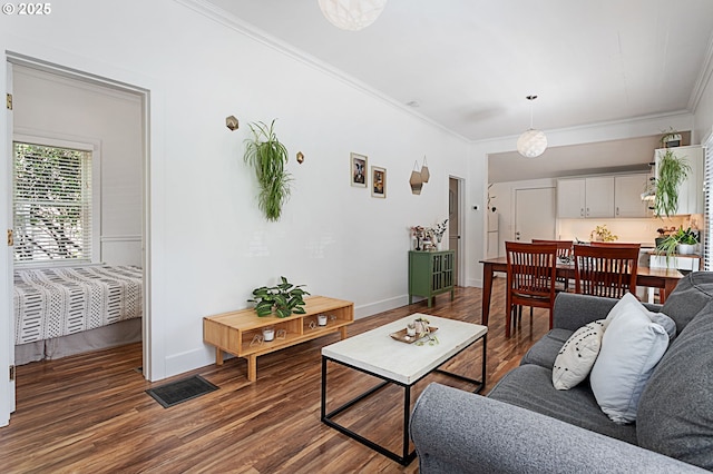 927 N Baldwin St, Portland, OR 97217 - living room featuring ornamental molding, wood finished floors, and baseboards
