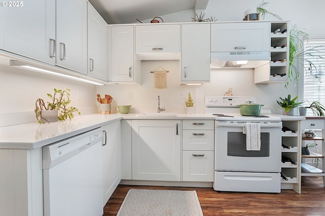 927 N Baldwin St, Portland, OR 97217 - kitchen featuring white appliances, a sink, under cabinet range hood, white cabinets, and vaulted ceiling