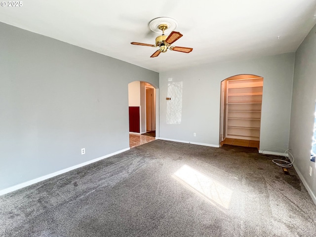 413 SW Brent Dr, John Day, OR 97845 - carpeted empty room featuring arched walkways, ceiling fan, and baseboards