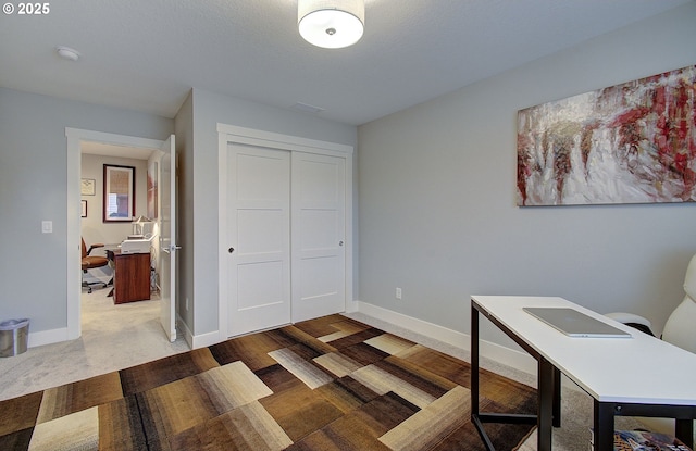 office area featuring hardwood / wood-style flooring and a textured ceiling