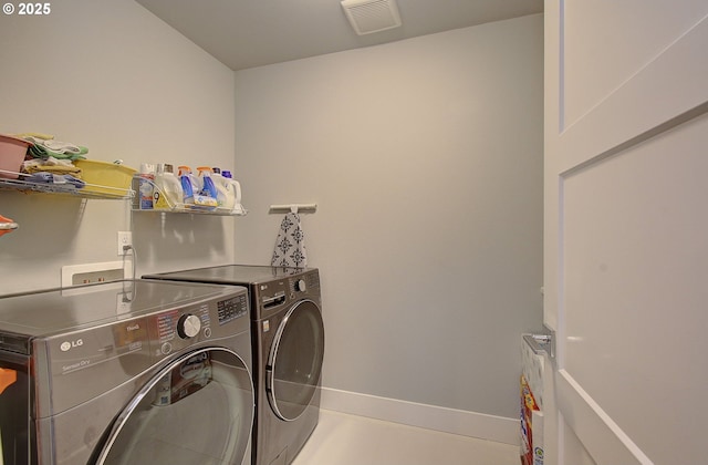 laundry area with washer and dryer