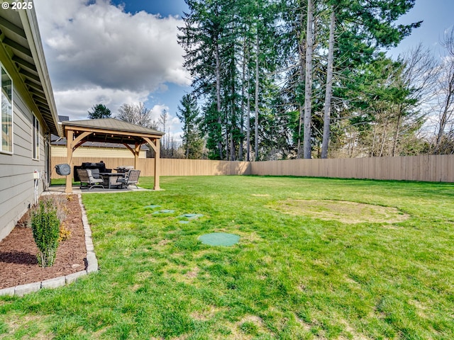 view of yard with a patio area, fence, and a gazebo