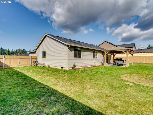 back of property featuring a lawn, a fenced backyard, crawl space, a gazebo, and a patio area